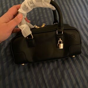 Elegant Black Satchel with Lock Detail